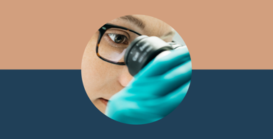 Reseacher is looking in a microscope